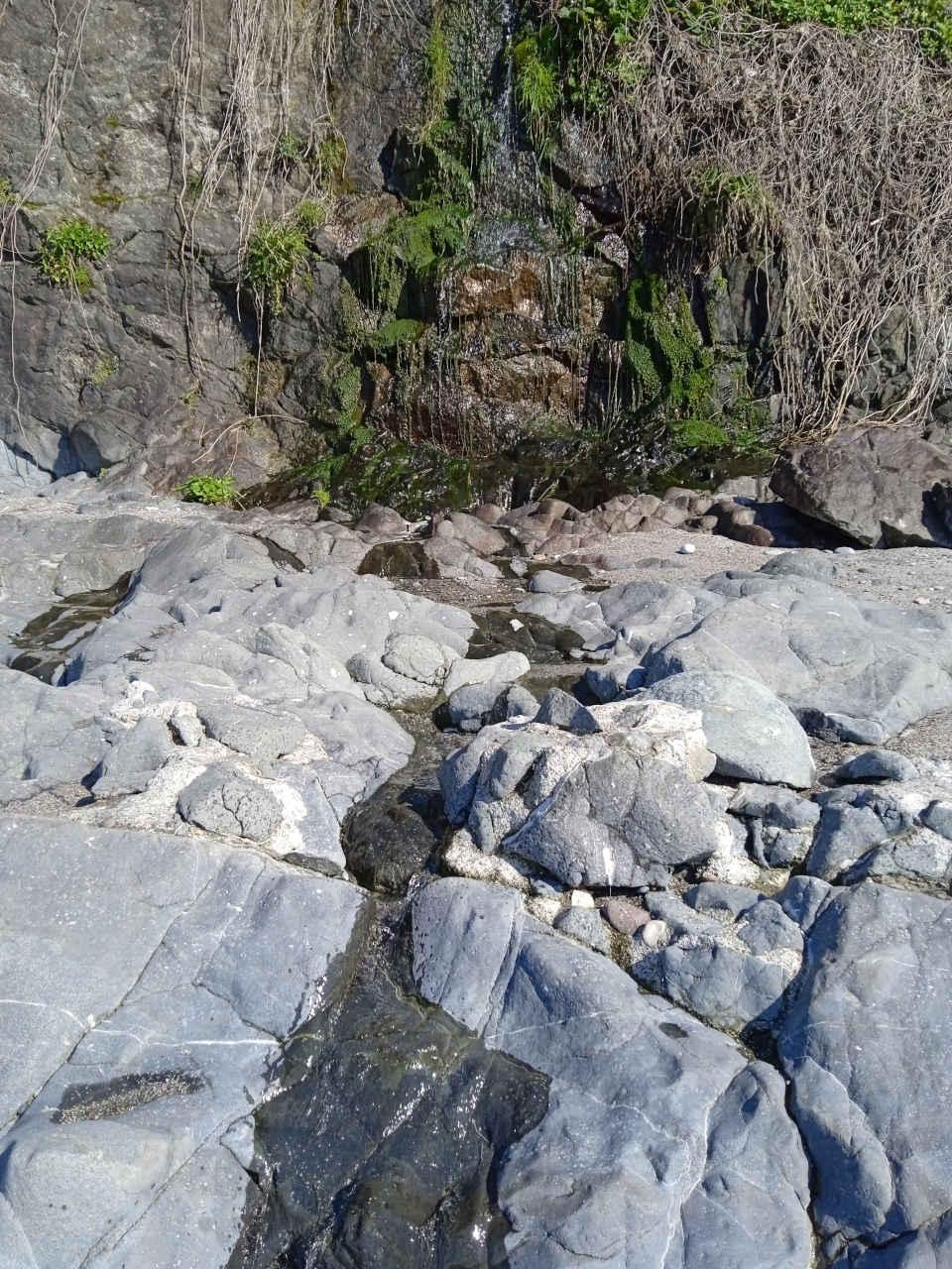 A small mountain waterfall and stream in the village of Tsikhisdziri in Georgia.